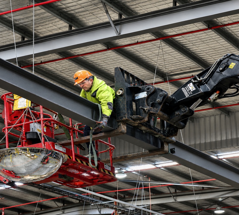 Galaxy Pollution Control technician on an elevated work platform